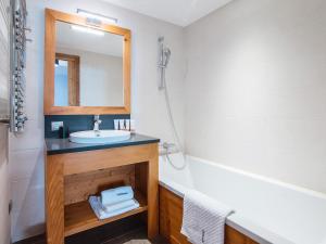 a bathroom with a sink and a mirror at Chalet Saint-Martin-de-Belleville, 5 pièces, 8 personnes - FR-1-344-777 in Saint-Martin-de-Belleville