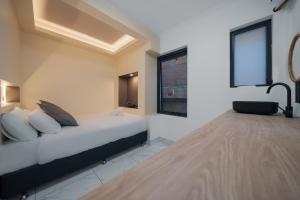 a bedroom with a bed and a window at Cozy M Hostel in Sydney +25 photos