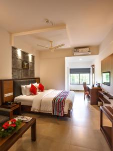 Un pat sau paturi într-o cameră la The Sanihara