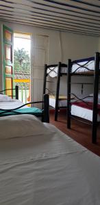 Ένα ή περισσότερα κρεβάτια σε δωμάτιο στο Palma de Cera Hostal