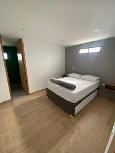 Ένα ή περισσότερα κρεβάτια σε δωμάτιο στο Balcones de la pradera by Hope +9 φωτογραφίες