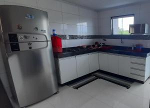 Kuchyň nebo kuchyňský kout v ubytování Cantinho do aconchego