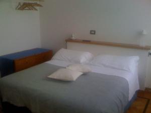 Postel nebo postele na pokoji v ubytování B&B Entro Le Mura