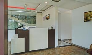 a lobby with a reception desk in a building at Itsy By Treebo - Vijaya Comforts, Coorg in Madikeri