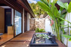 Сад в The Tubkaak Krabi Boutique Resort