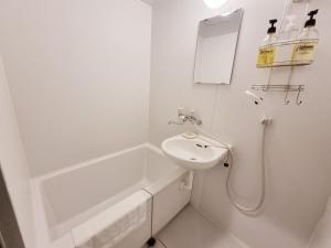 Kylpyhuone majoituspaikassa KYU KYU HOTEL