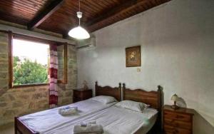 Posteľ alebo postele v izbe v ubytovaní Stone Village Hotel Apartments