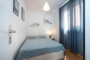 Posteľ alebo postele v izbe v ubytovaní Apartment Helena Rovanjska