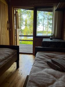 Postel nebo postele na pokoji v ubytování Metsä Kolo