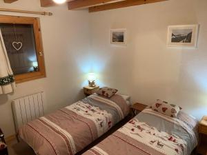 En eller flere senge i et værelse på Chalet proche Morzine et lac Léman WIFI offert