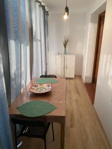 a dining room table with a plate of food on it at Studio Saint cyprien Plage in Saint-Cyprien