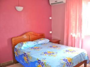 Кровать или кровати в номере Villa Bougainville Touriste Résidence