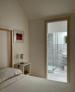 Posteľ alebo postele v izbe v ubytovaní Virgilio 82 - Penthouse With Terrace