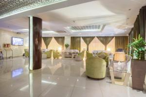 a lobby with couches and chairs in a building at Sama Al Qasr - Khurais in Riyadh