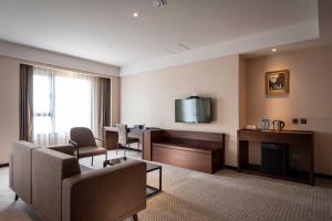 TV a/nebo společenská místnost v ubytování Lailai Hotel
