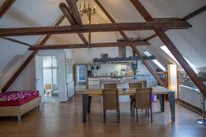 a kitchen and dining room with a table and chairs at Martin I's Ferienwohnung in Klotten