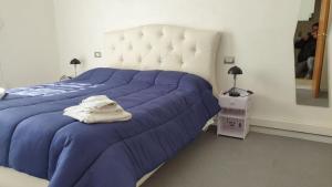 Posteľ alebo postele v izbe v ubytovaní MADB&B