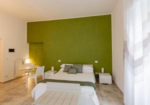Un pat sau paturi într-o cameră la B&B Tenuta Fanelli