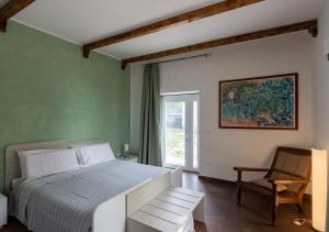 Un pat sau paturi într-o cameră la B&B Tenuta Fanelli