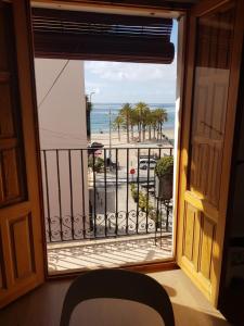 a view of the beach from a window at Segunda casa de Ana Lucia en la playa in Villajoyosa