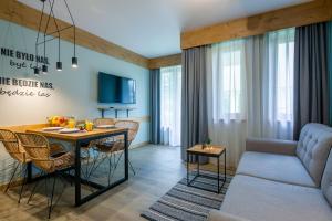 Televízia a/alebo spoločenská miestnosť v ubytovaní Apartament Forest Centrum