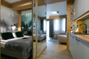 Posteľ alebo postele v izbe v ubytovaní Apartament Forest Centrum