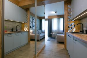 Kuchyňa alebo kuchynka v ubytovaní Apartament Forest Centrum
