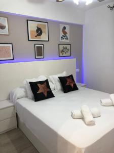 En eller flere senge i et værelse på Olivia Resort Marbella