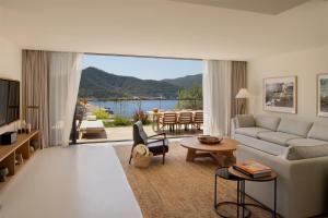 a living room with a couch and a table at Six Senses Ibiza in Portinatx