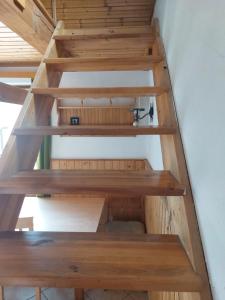 a stairwell in a house with wooden shelves at apartmán v areálu Hospoda u Dračice in Suchdol nad Lužnicí
