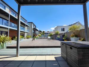 a view of a courtyard in a apartment building at 3 Putsborough - Luxury Apartment at Byron Woolacombe, only 4 minute walk to Woolacombe Beach! in Woolacombe