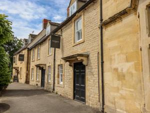 a row of brick buildings on a street at The Loft in Stow on the Wold