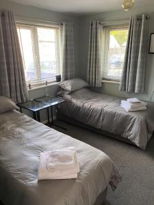 Postel nebo postele na pokoji v ubytování Wellbrook Rooms