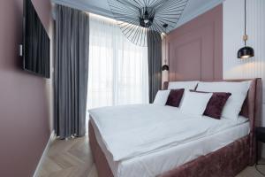 Posteľ alebo postele v izbe v ubytovaní Apartamenty The View Hevenia