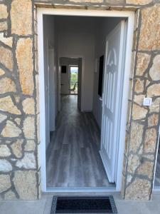 a hallway leading into a house with a door at Appartement Vila Fajen in Sukošan +48 photos