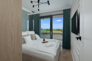 Posteľ alebo postele v izbe v ubytovaní Apartamenty The View Hevenia