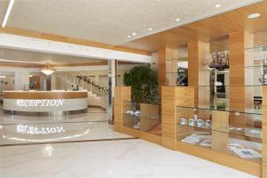 a store with glass shelves in a mall at Hotel Golden Dune in Sunny Beach