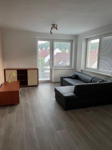 a living room with a couch and a table at U Lípy - Tilia in Tábor