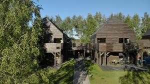 an aerial view of a large wooden house at Lubia apartamenty nad morzem w Lubiatowie in Lubiatowo