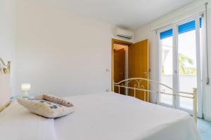 Ένα ή περισσότερα κρεβάτια σε δωμάτιο στο Residence La Perla - Zaffiro