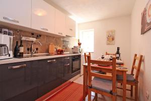 Kuchyň nebo kuchyňský kout v ubytování Apartment Leo 2180 + 20 fotografií