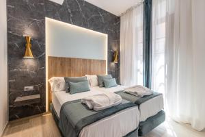 BiBo Suites San Agustín客房内的一张或多张床位
