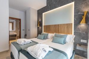 BiBo Suites San Agustín客房内的一张或多张床位