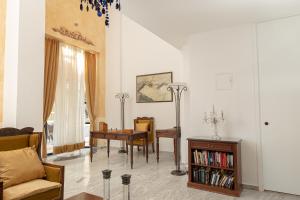 a living room with a couch and a table at Santa Marina Unique Hotel in Agios Nikolaos