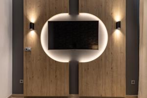 BiBo Suites San Agustín的电视和/或娱乐中心