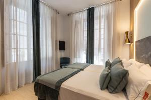 BiBo Suites San Agustín客房内的一张或多张床位