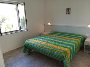 Cama o camas de una habitación en Holidays in Vieste in charming villas - 4