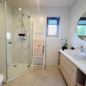 a bathroom with a shower and a sink at Dębowisko Sasino in Sasino