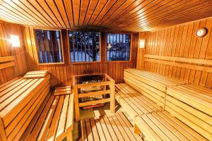 an inside view of a sauna with benches and windows at DIEHLs Hotel in Koblenz