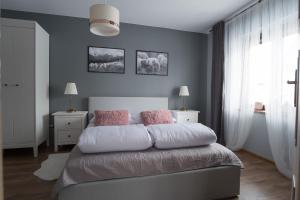 Posteľ alebo postele v izbe v ubytovaní Apartament Henrykówka Apartzakop
